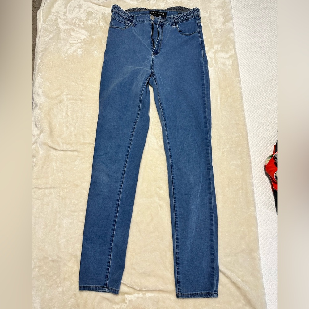 Bullhead Denim Co high waisted skinny jeans with braided belt.